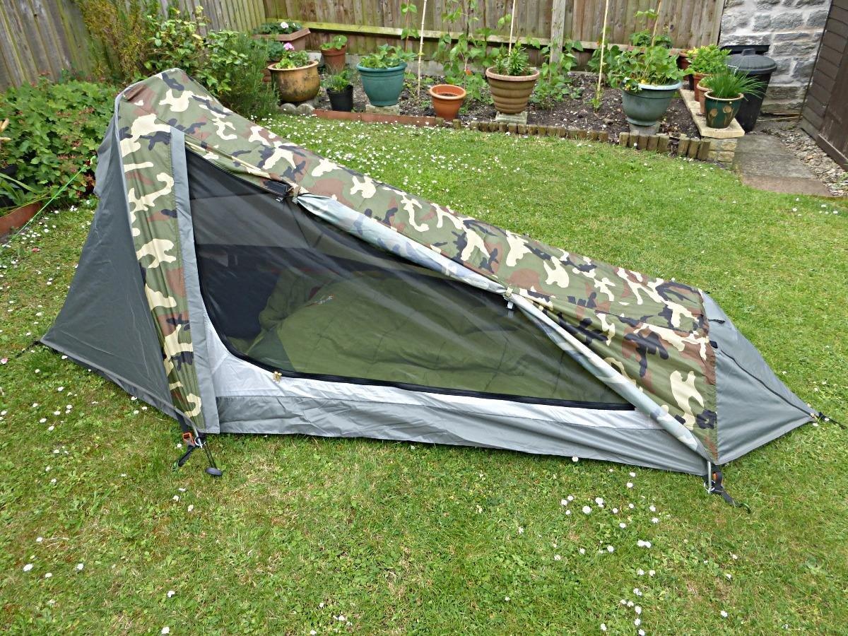 Geertop tent in a garden with the door open, showing the mesh