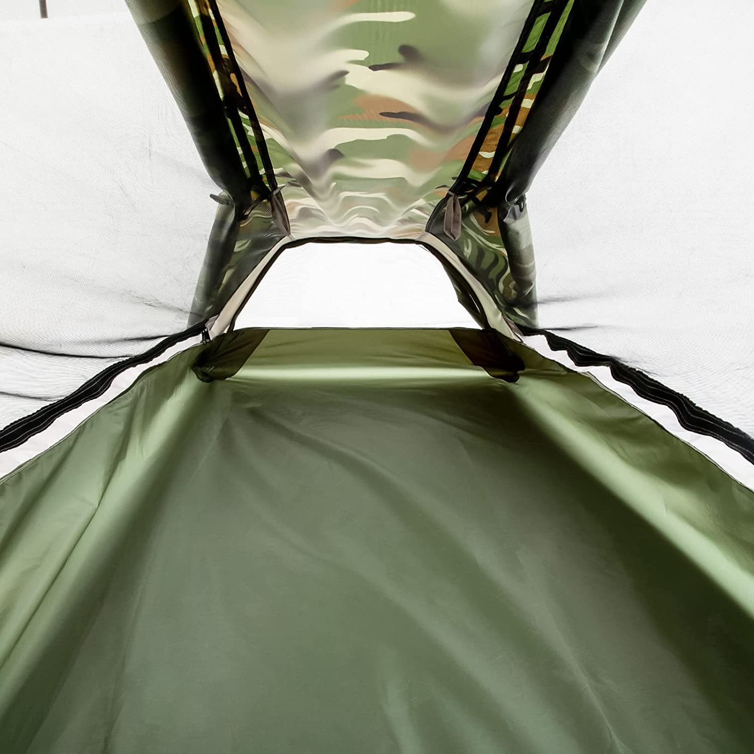 Inside the Geertop tent looking out at the door, green floor