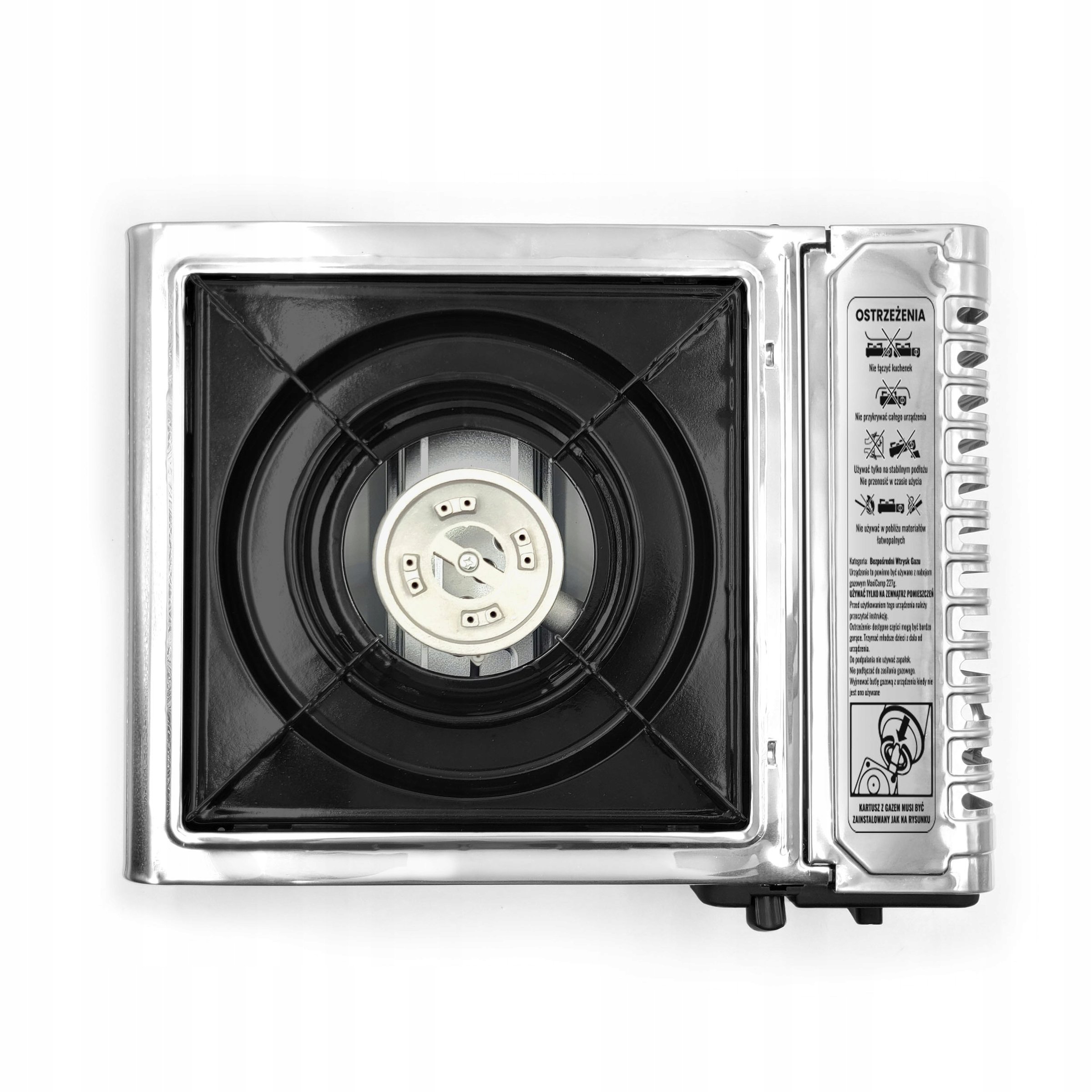 MaxiCamp stove from above: the burner in the black grate and the cover of the canister compartment