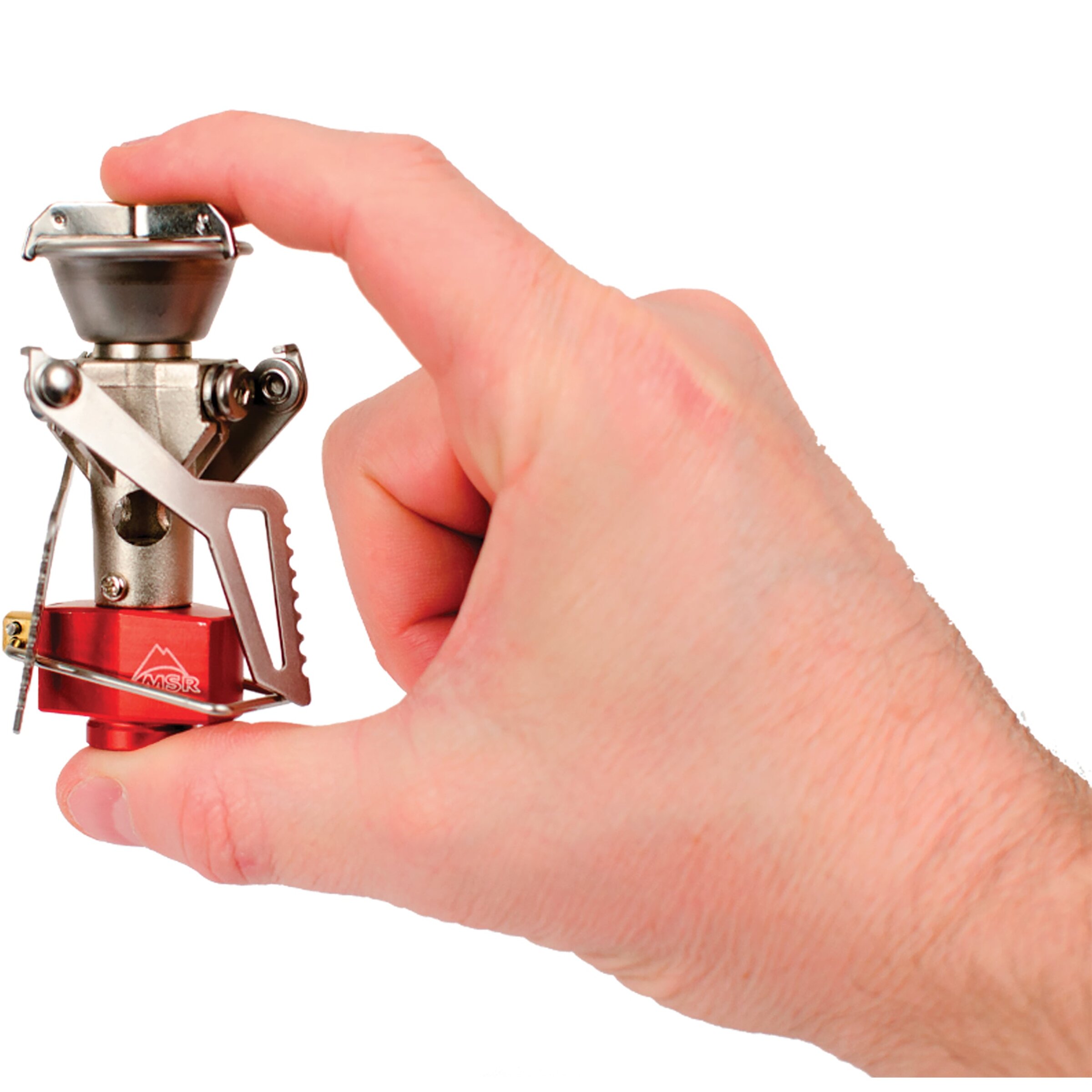 Folded MSR PocketRocket 2 burner held between the fingers of one hand, showing how small it is