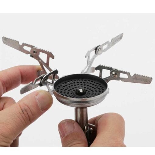 Hands fitting the 4Flex pot support onto the burner head of the SOTO WindMaster