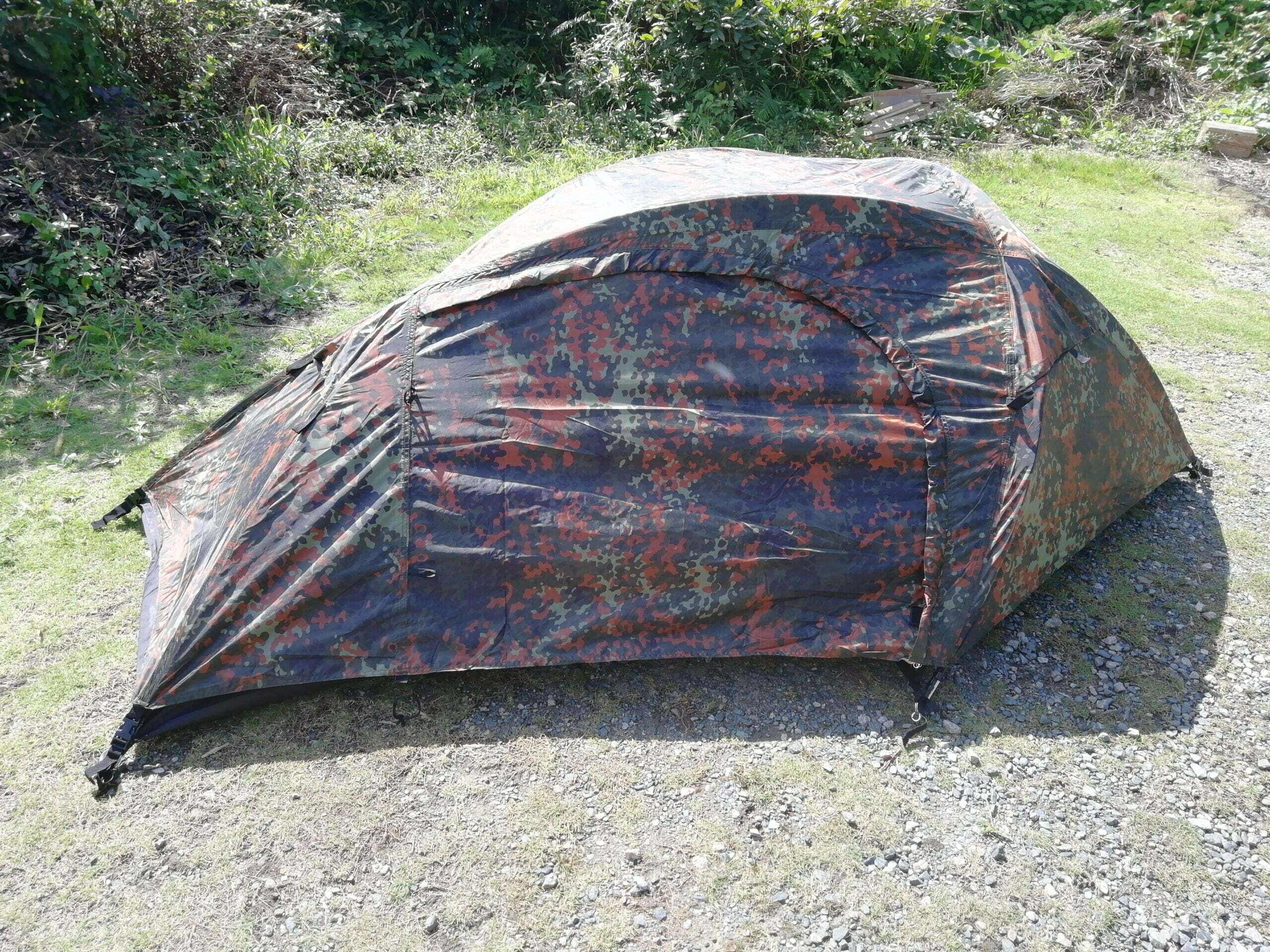 Mil-Tec Recom one-person tent in Flecktarn camo pitched on gravel