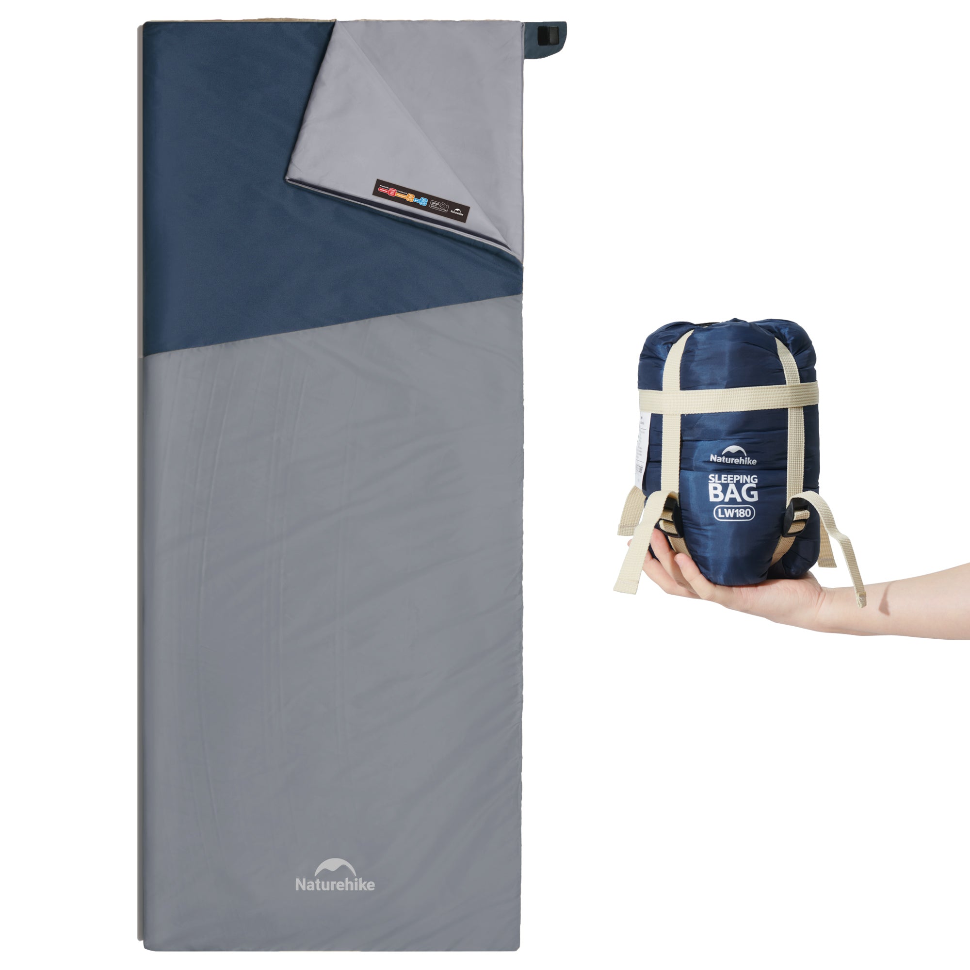 Zielony śpiwór-koperta Naturehike LW180 częściowo rozpięty, obok worek